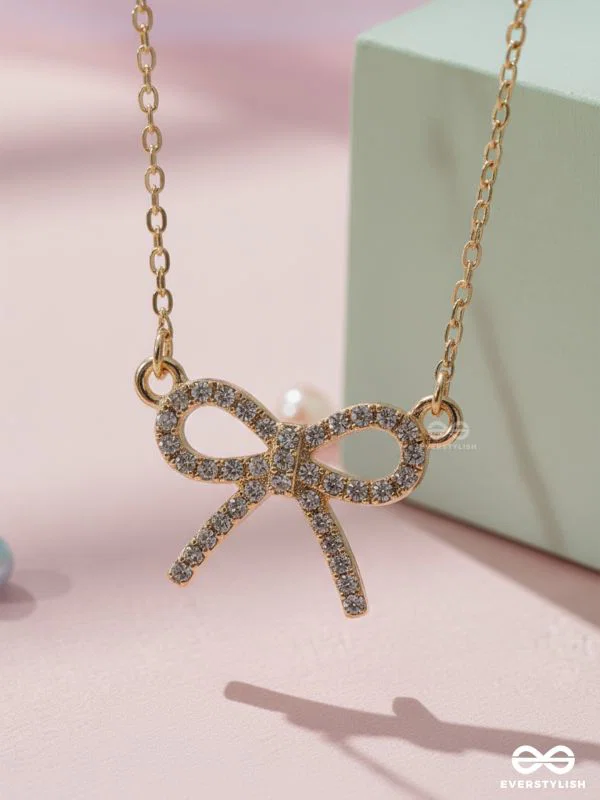 TIED IN GOLD- MINIMALIST BOW NECKPIECE